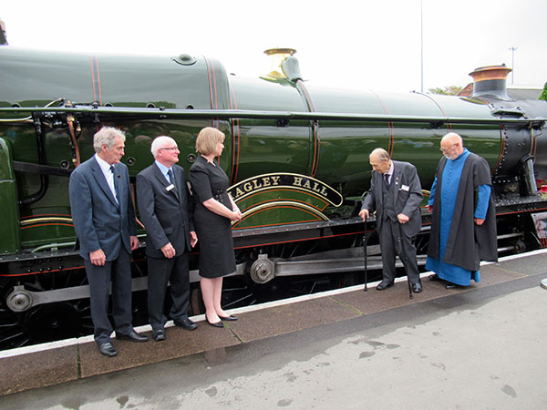 Keith Hall, Paul Hobson, Helen Smith, Columb Howell and Reverend Mike Kneen admire the new 4930 nameplate